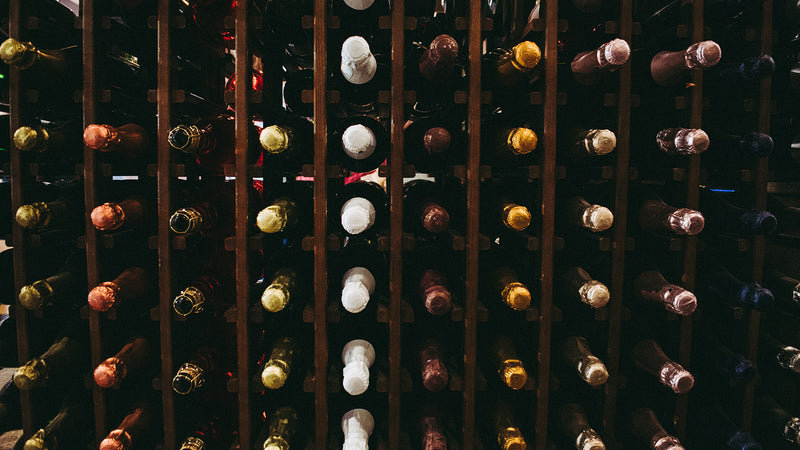 Wine bottles in storage on racks