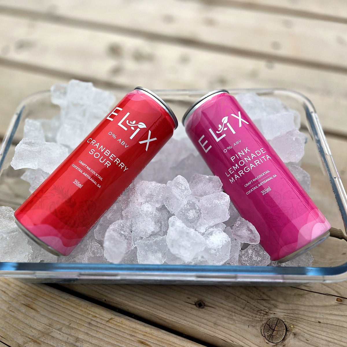 Elix Pink Lemonade Margarita and Cranberry Sour cans chilling on ice
