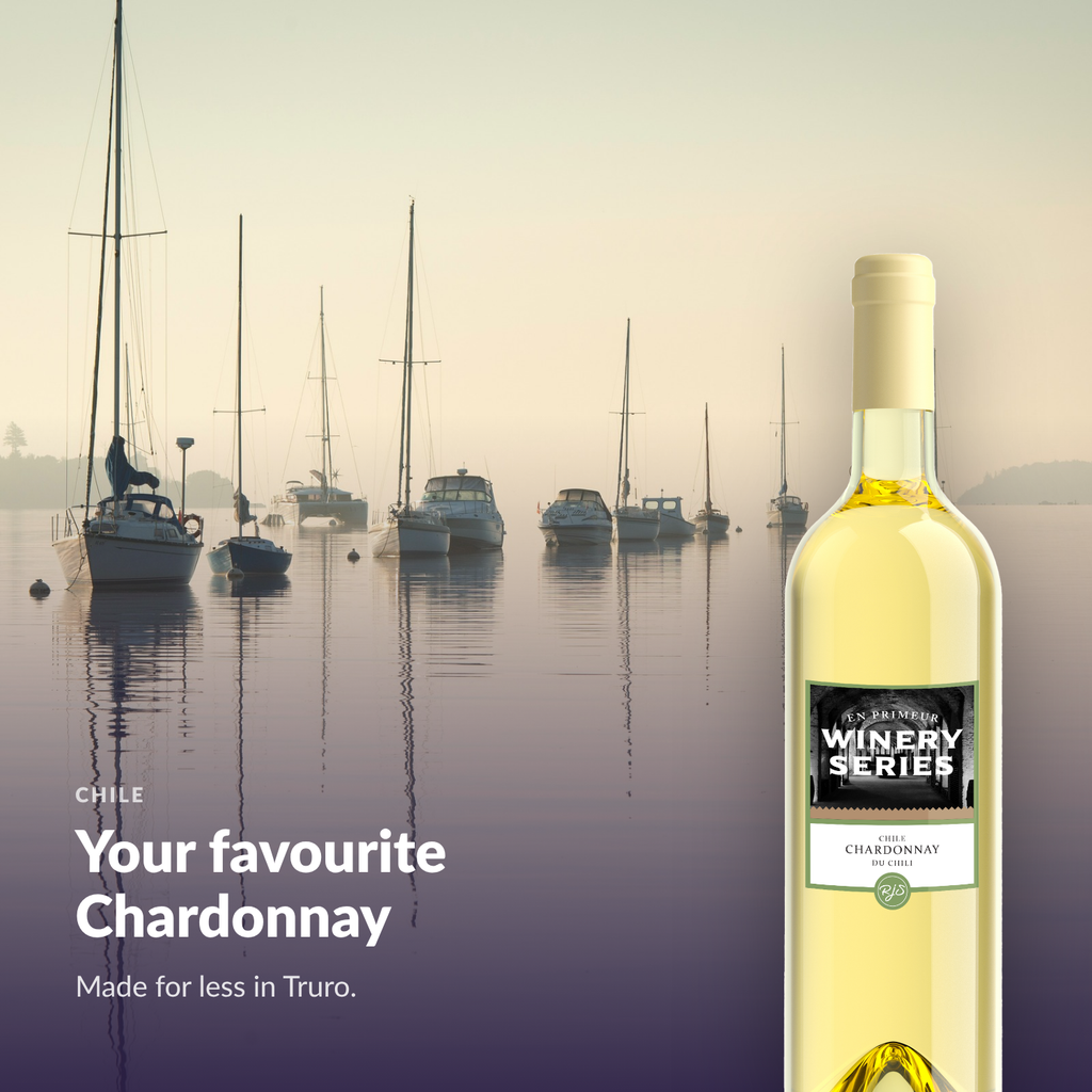 En Primeur Winery Series Chardonnay bottle against an Atlantic Canadian harbour at dawn