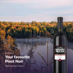 En Primeur Winery Series Pinot Noir bottle against an Atlantic Canadian autumn landscape