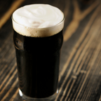 A full pint of Festa Brew BMR Porter on a dark wooden table