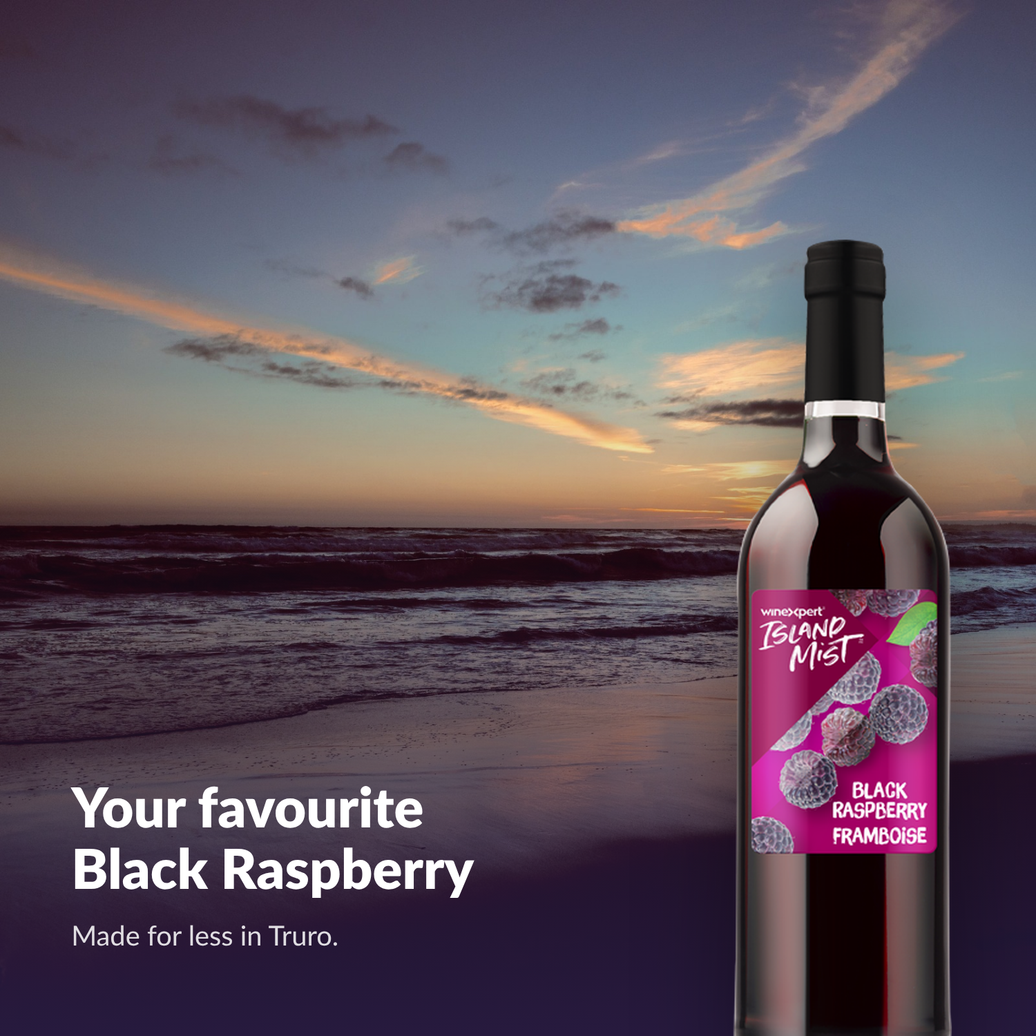 Island Mist Black Raspberry bottle at the beach at sunset