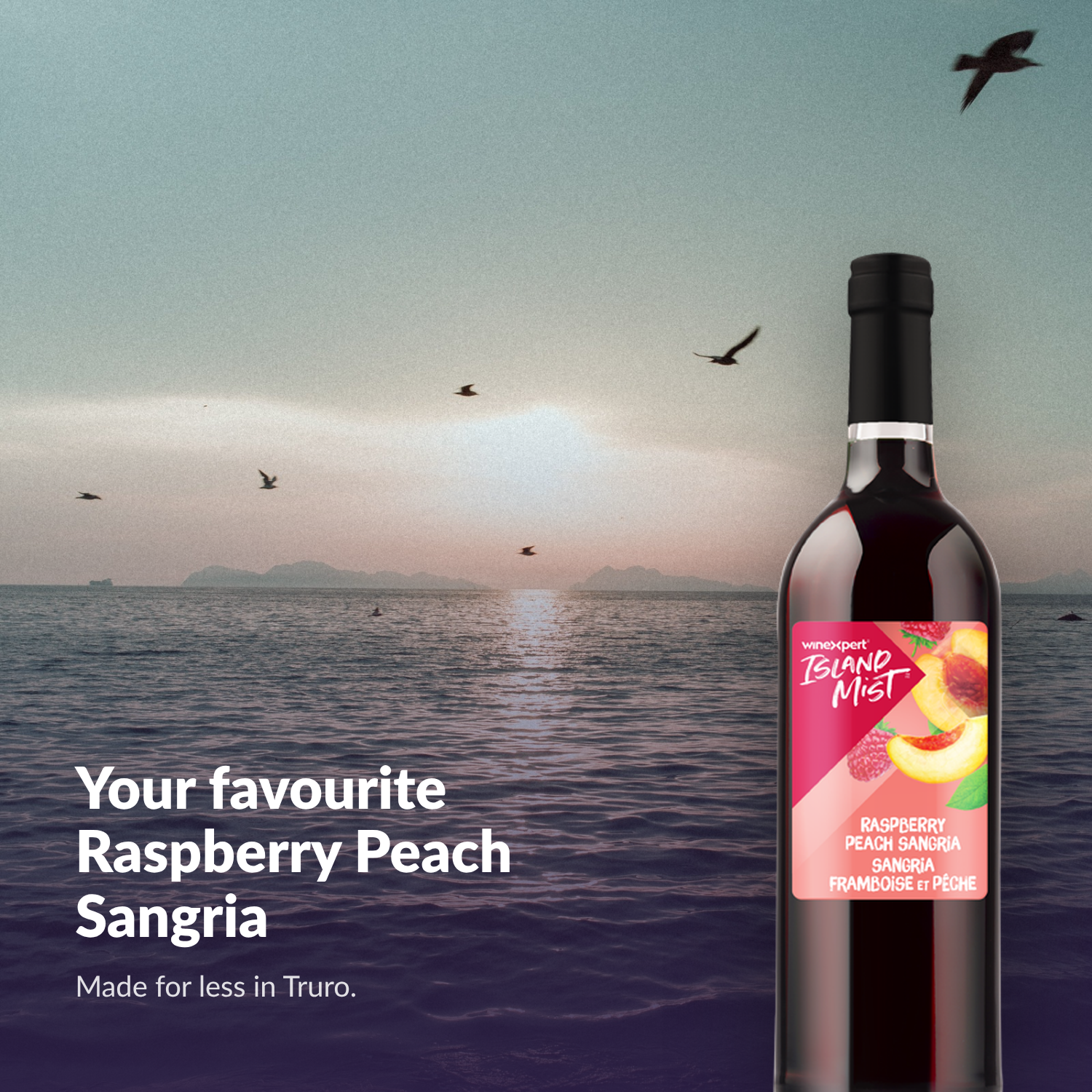 Island Mist Raspberry Peach Sangria bottle by the sea