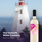 Island Mist White Cranberry bottle by a lighthouse