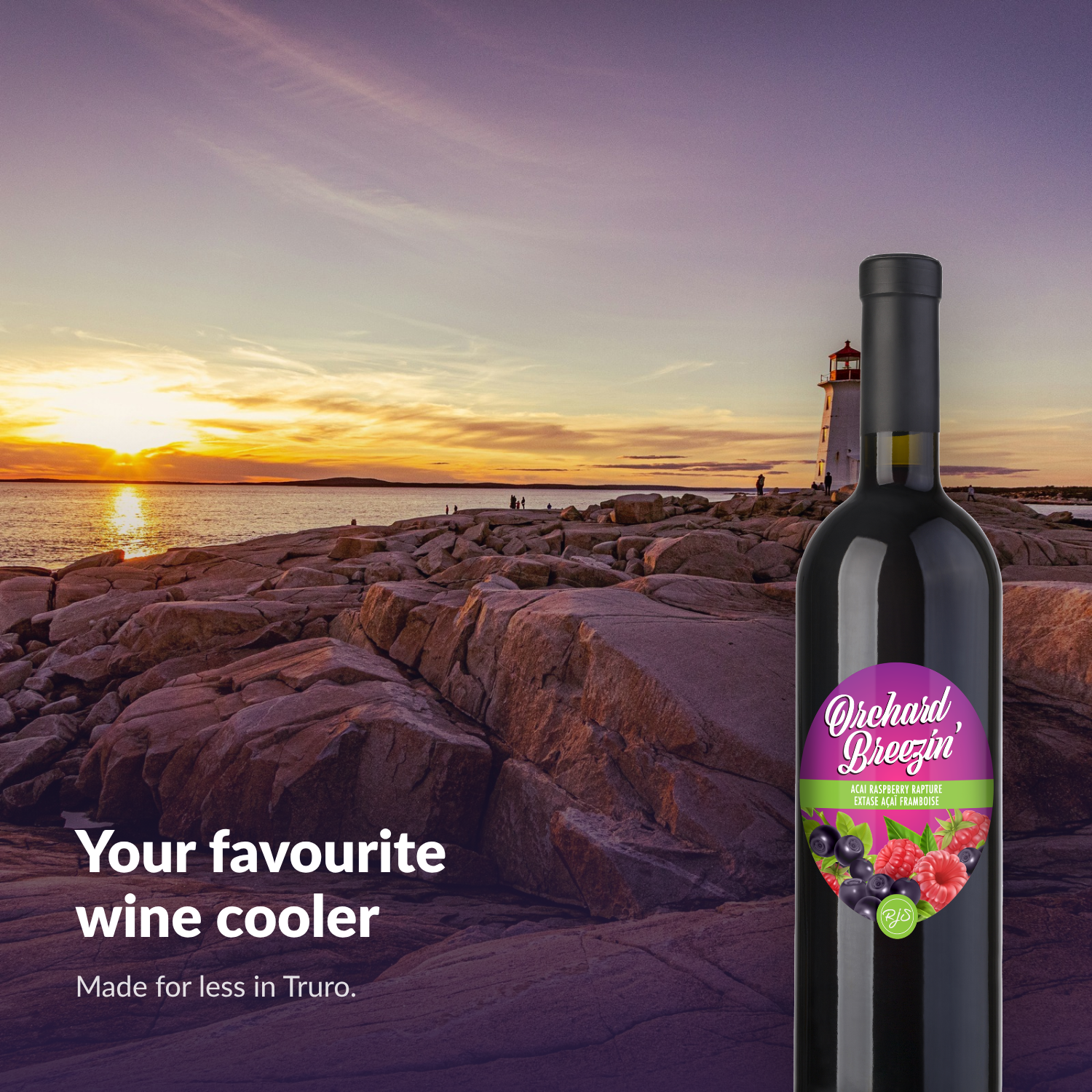 Orchard Breezin' Acai Raspberry Rapture bottle on the Nova Scotia coast at sunset