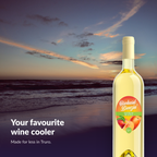 Orchard Breezin' Peach Perfection bottle on an Atlantic Canadian beach at sunset