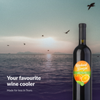 Orchard Breezin' Seville Orange Sangria bottle above a coastal sunrise