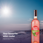 Orchard Breezin' Wild Watermelon bottle on a bright Atlantic Canadian beach